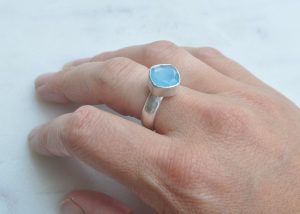 One off, limited edition designs. By Clare Quinlan. Aquamarine cushion cut stone set on a chunky sterling silver band.